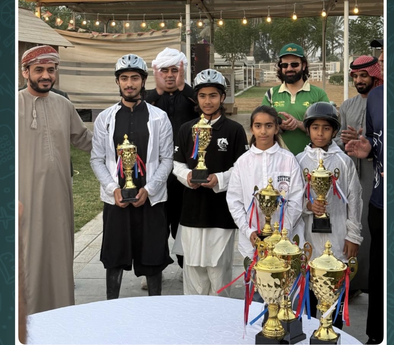 The children at an official UAE equestrian trophy ceremony with officials